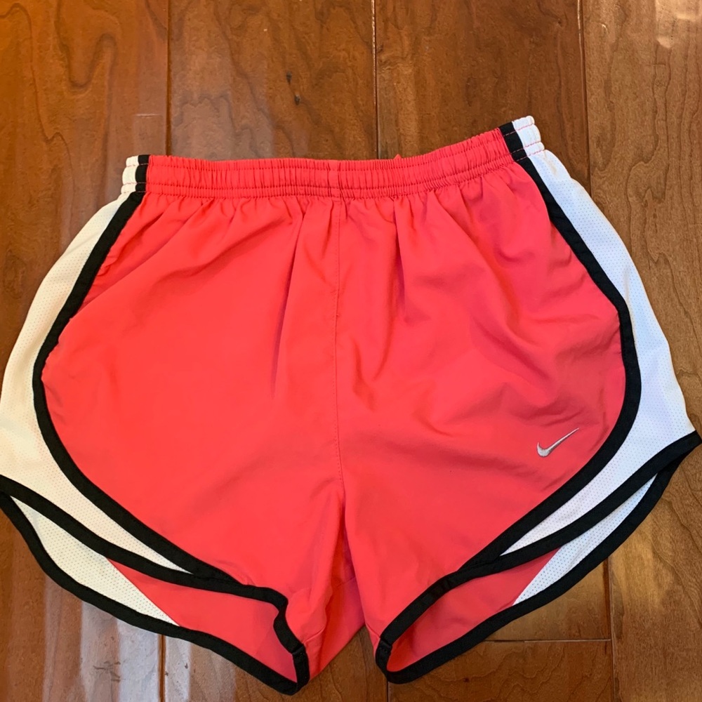 Pink and white nike running shorts